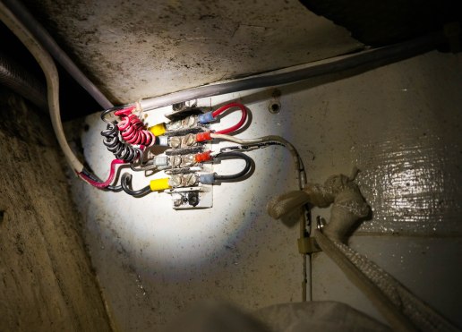 The lights we use when cruising at night have wiring that comes in through the hull and Craig had to disconnect and reconnect it.